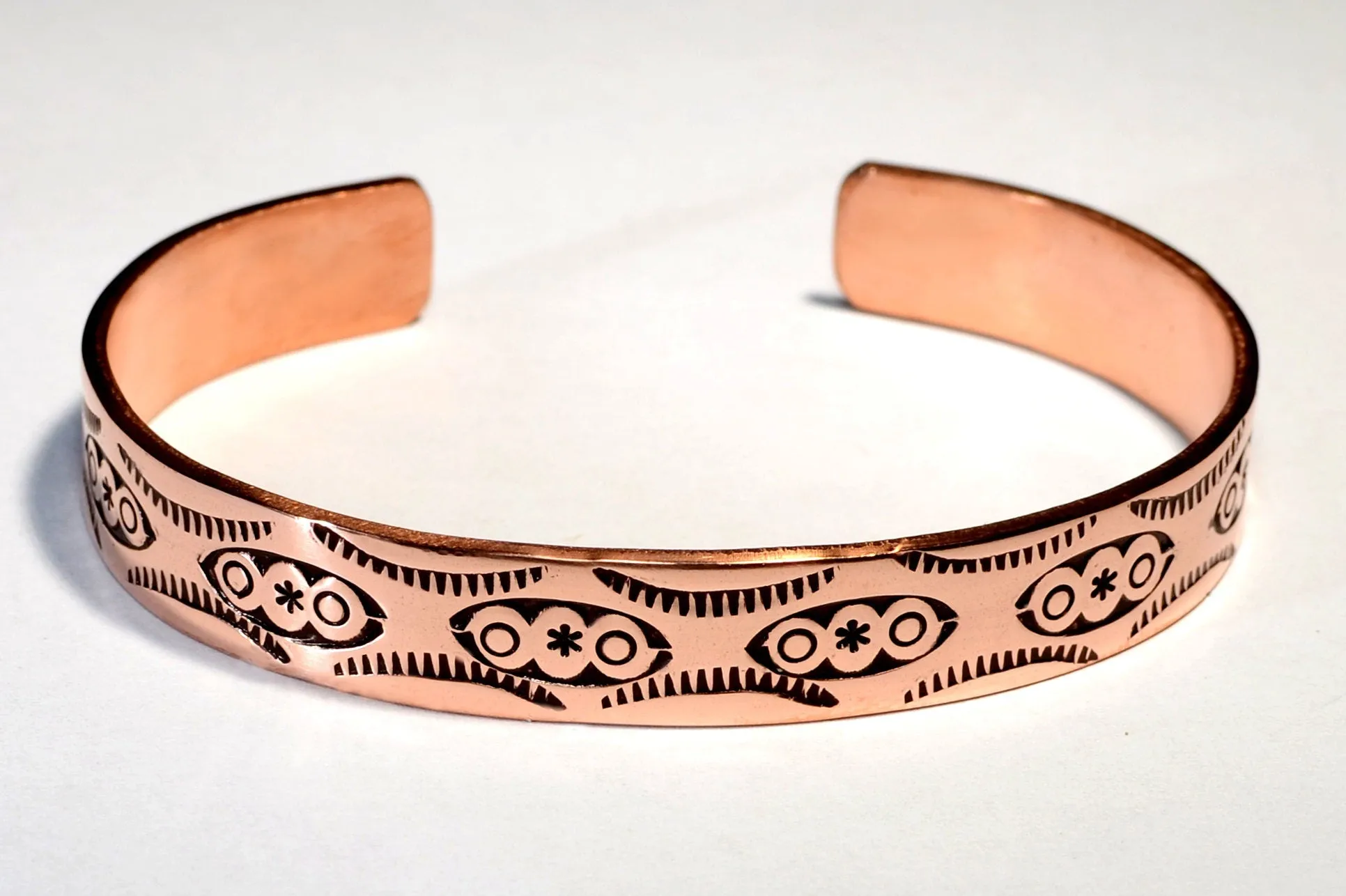Copper cuff bracelet imprinted with Native American Handmade Metal Stamps