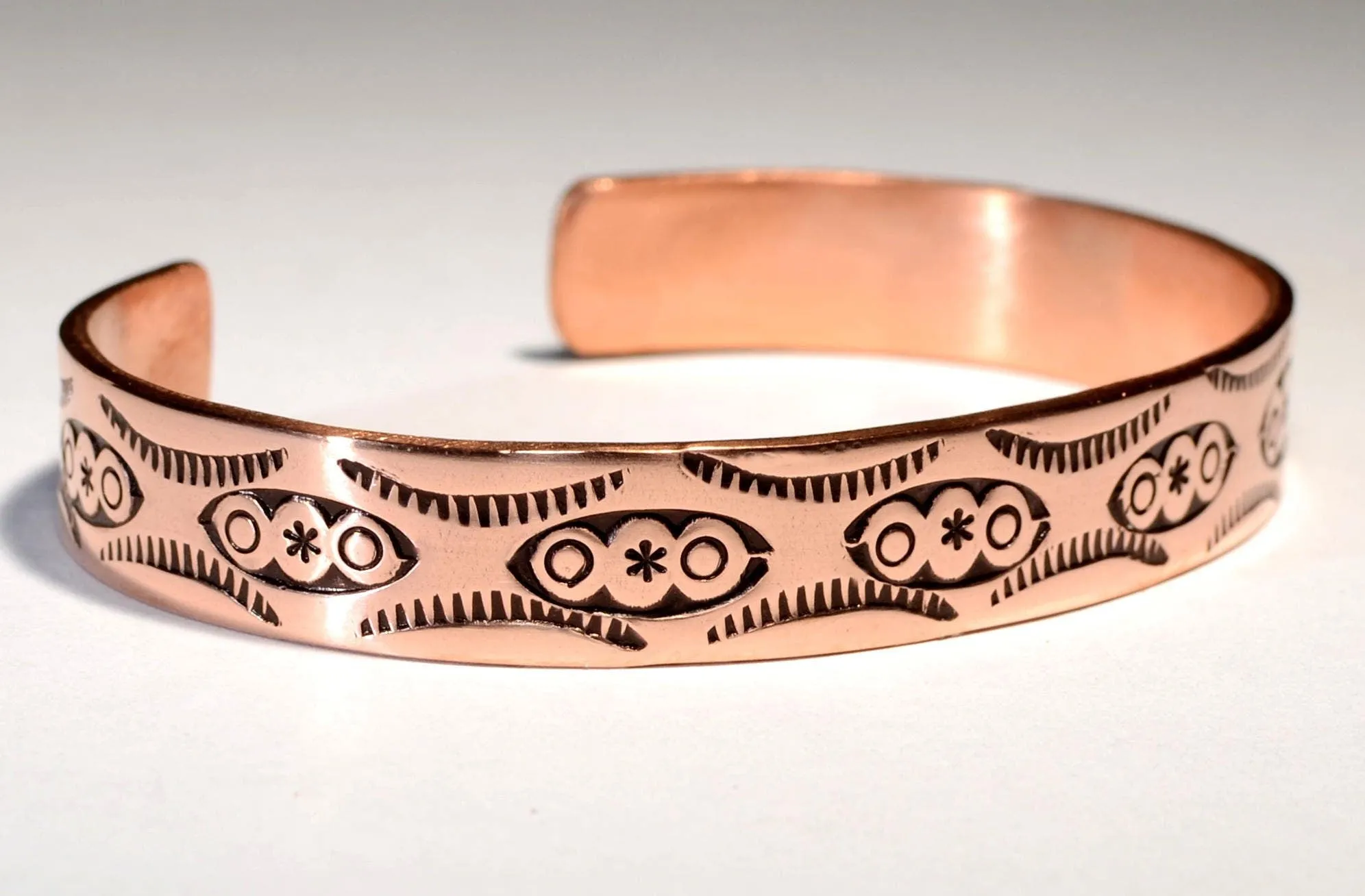 Copper cuff bracelet imprinted with Native American Handmade Metal Stamps