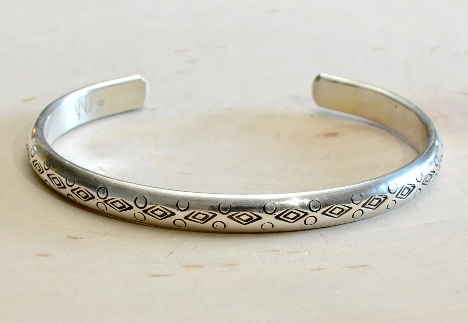Half Round Cuff Bracelet in Sterling Silver imprinted using Handmade Native American Metal Stamps