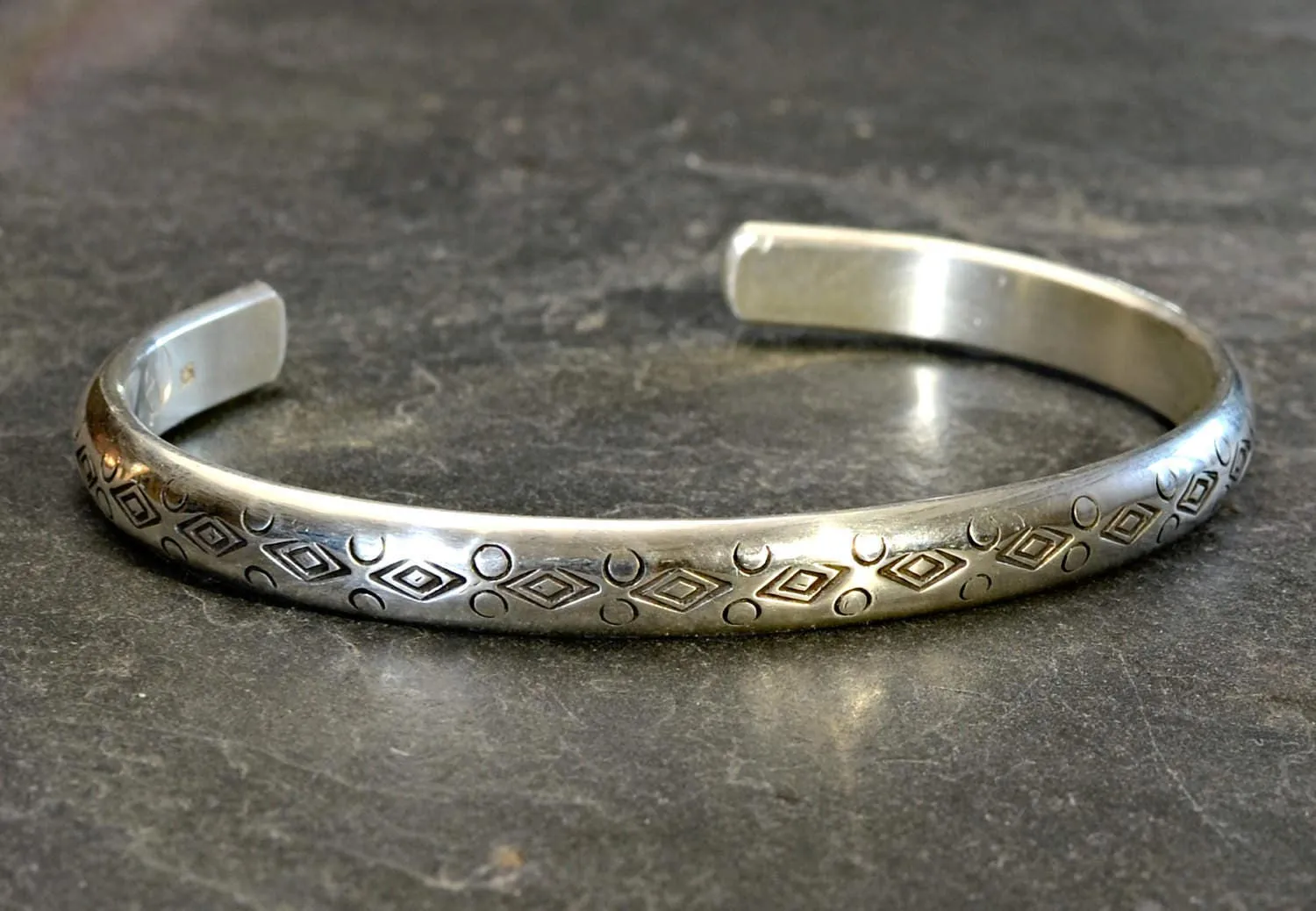 Half Round Cuff Bracelet in Sterling Silver imprinted using Handmade Native American Metal Stamps