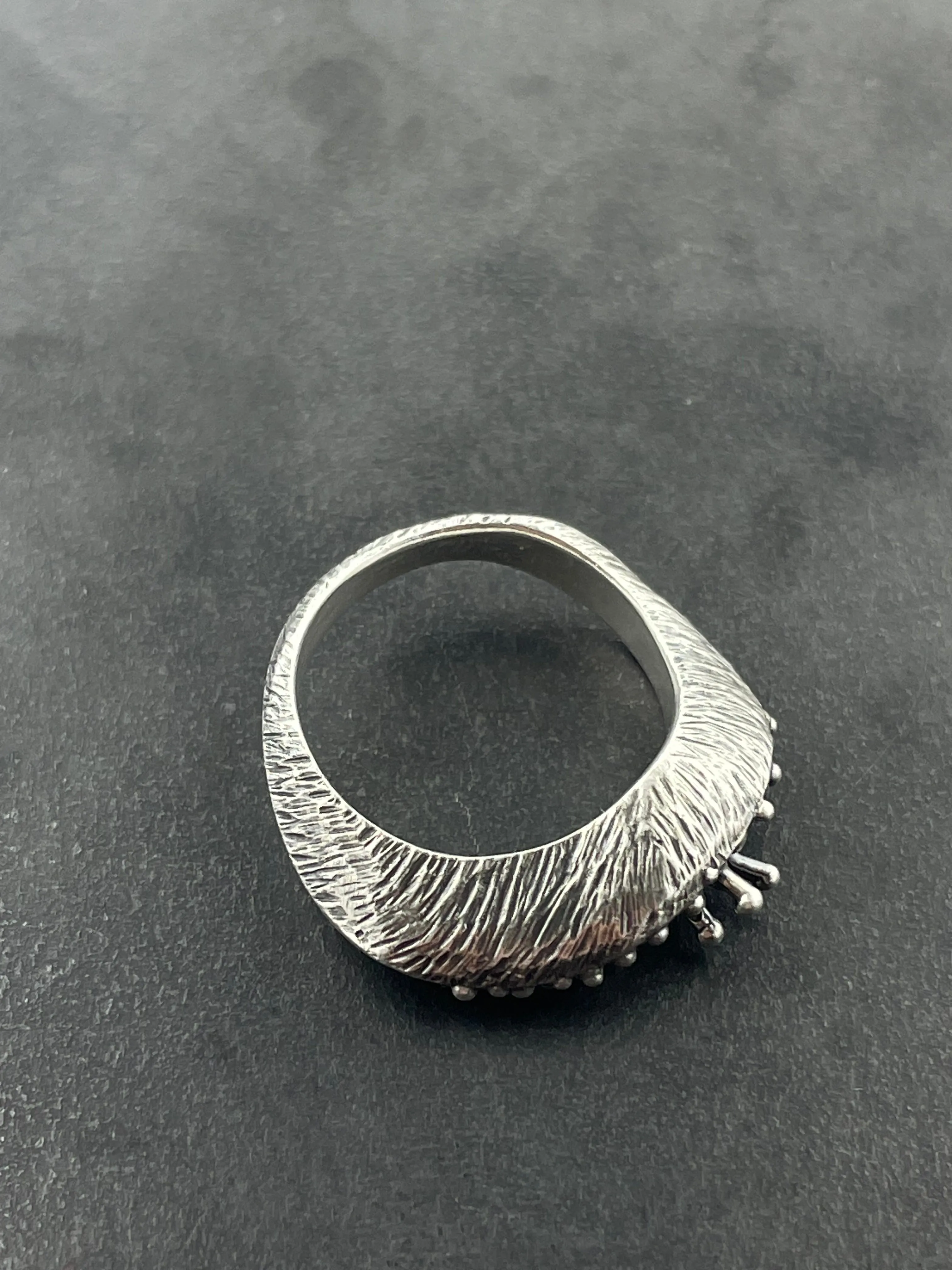 In Flow ring with knobbly  and scratch textures