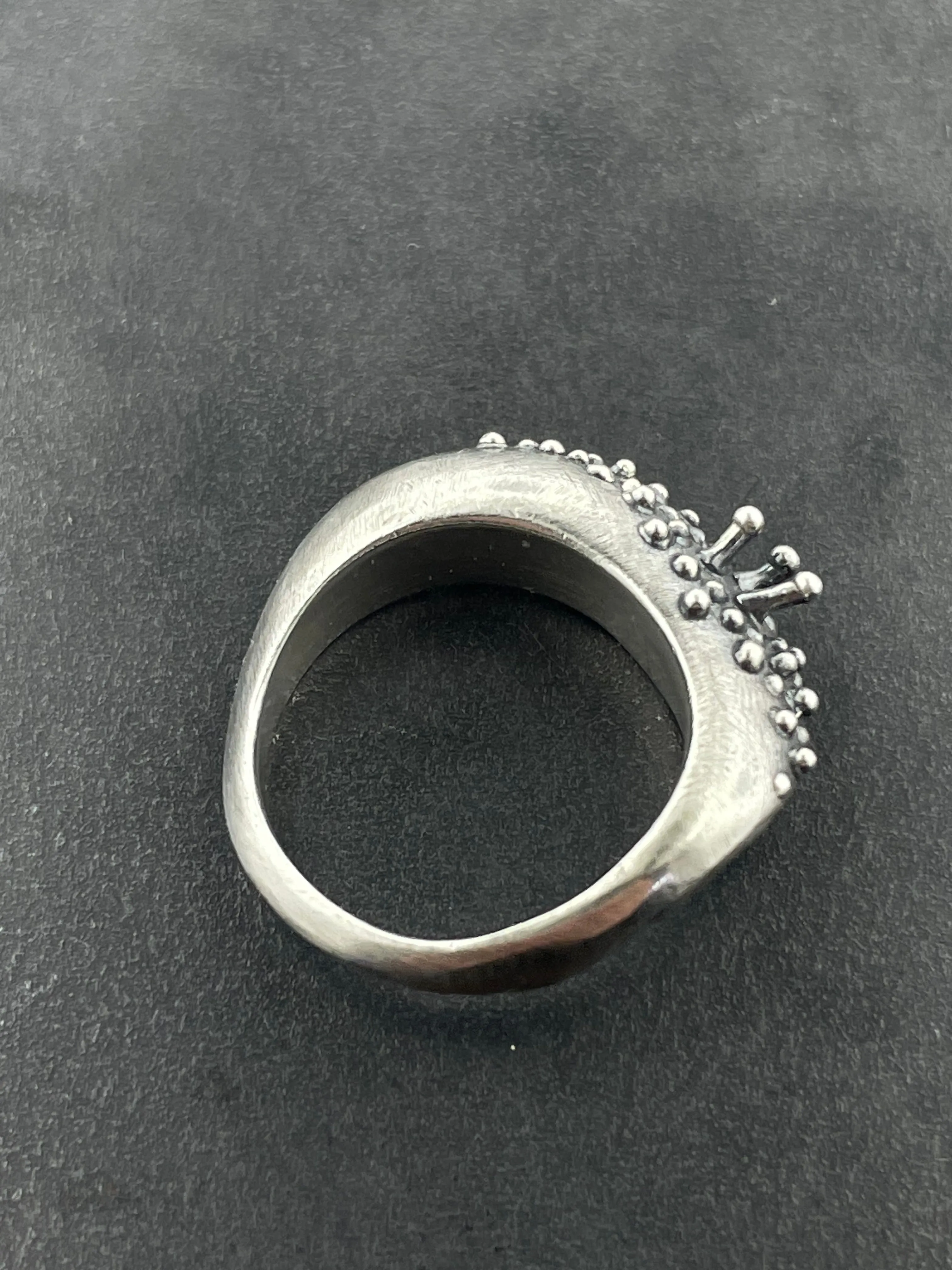 In Flow ring with knobbly  and scratch textures
