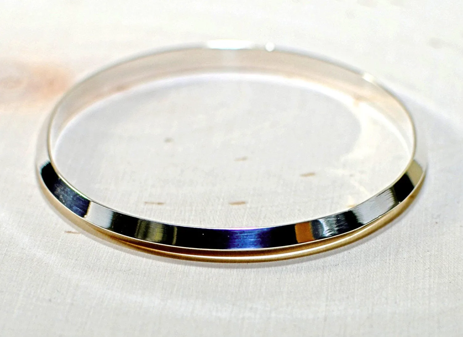 Triangular wire sterling silver bangle