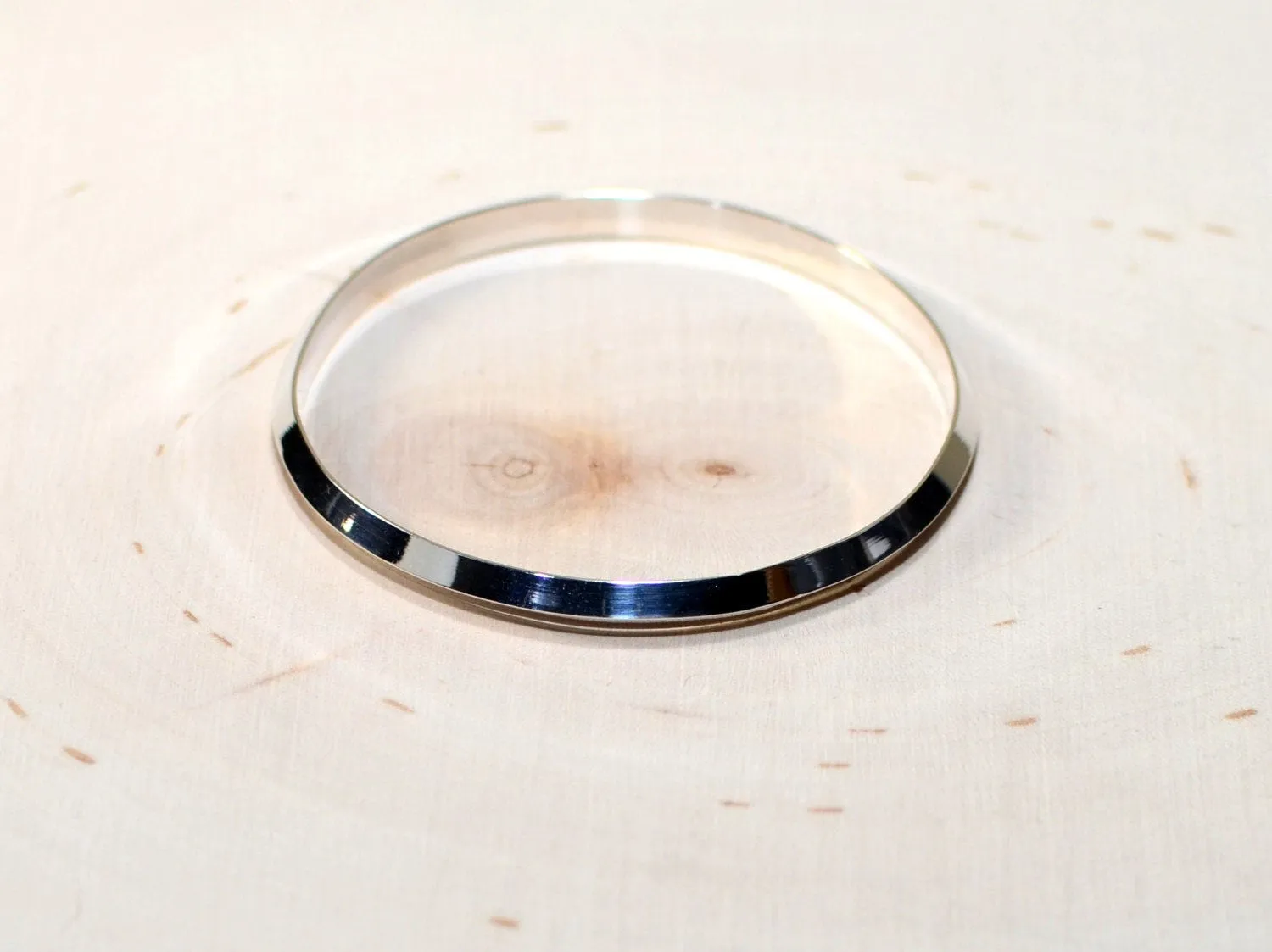 Triangular wire sterling silver bangle