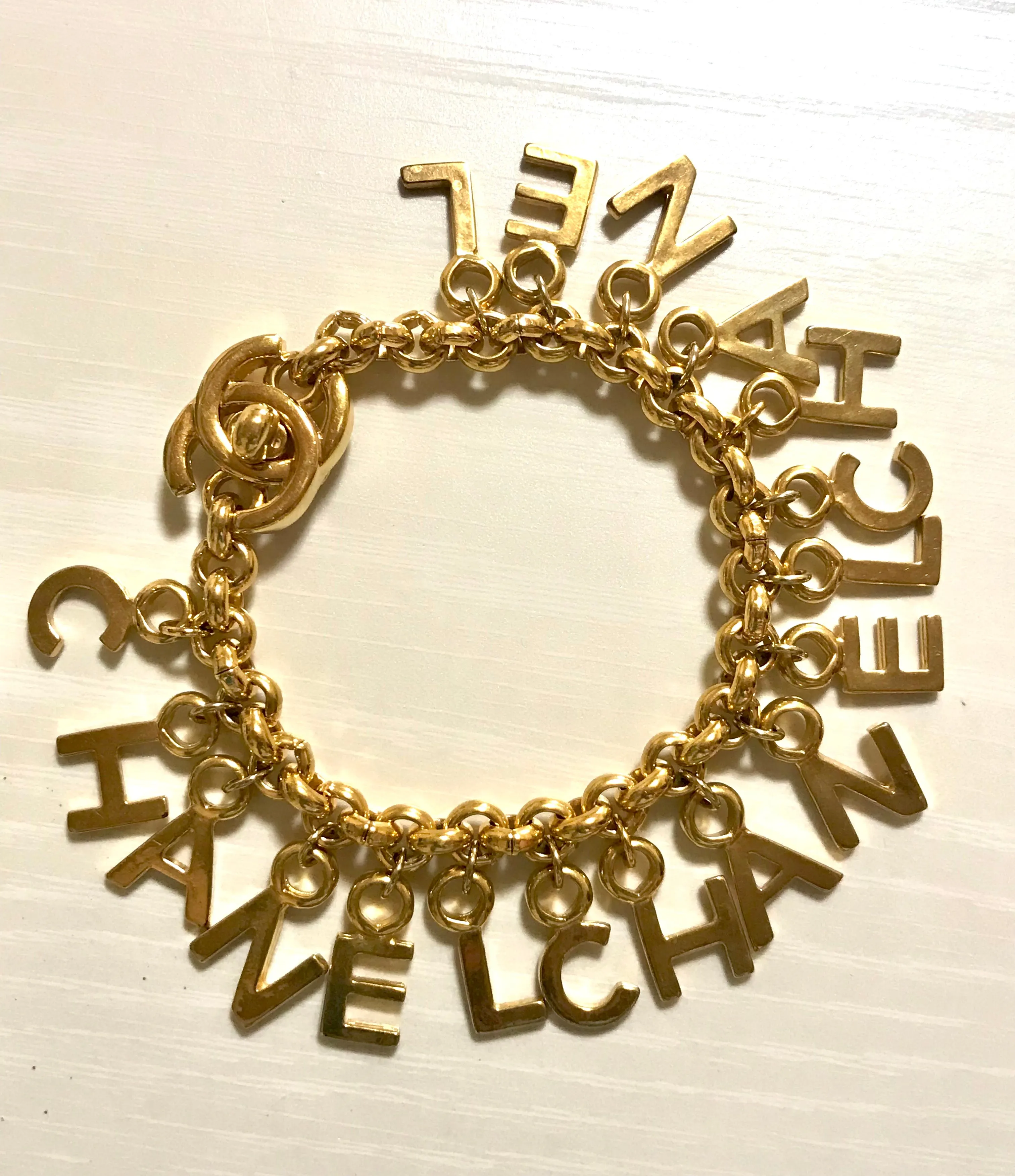 Vintage Chanel Turnlock CC closure and CHANEL letter dangle bracelet. Must have 90s jewelry. CC and logo letter charm bracelet. 060801re