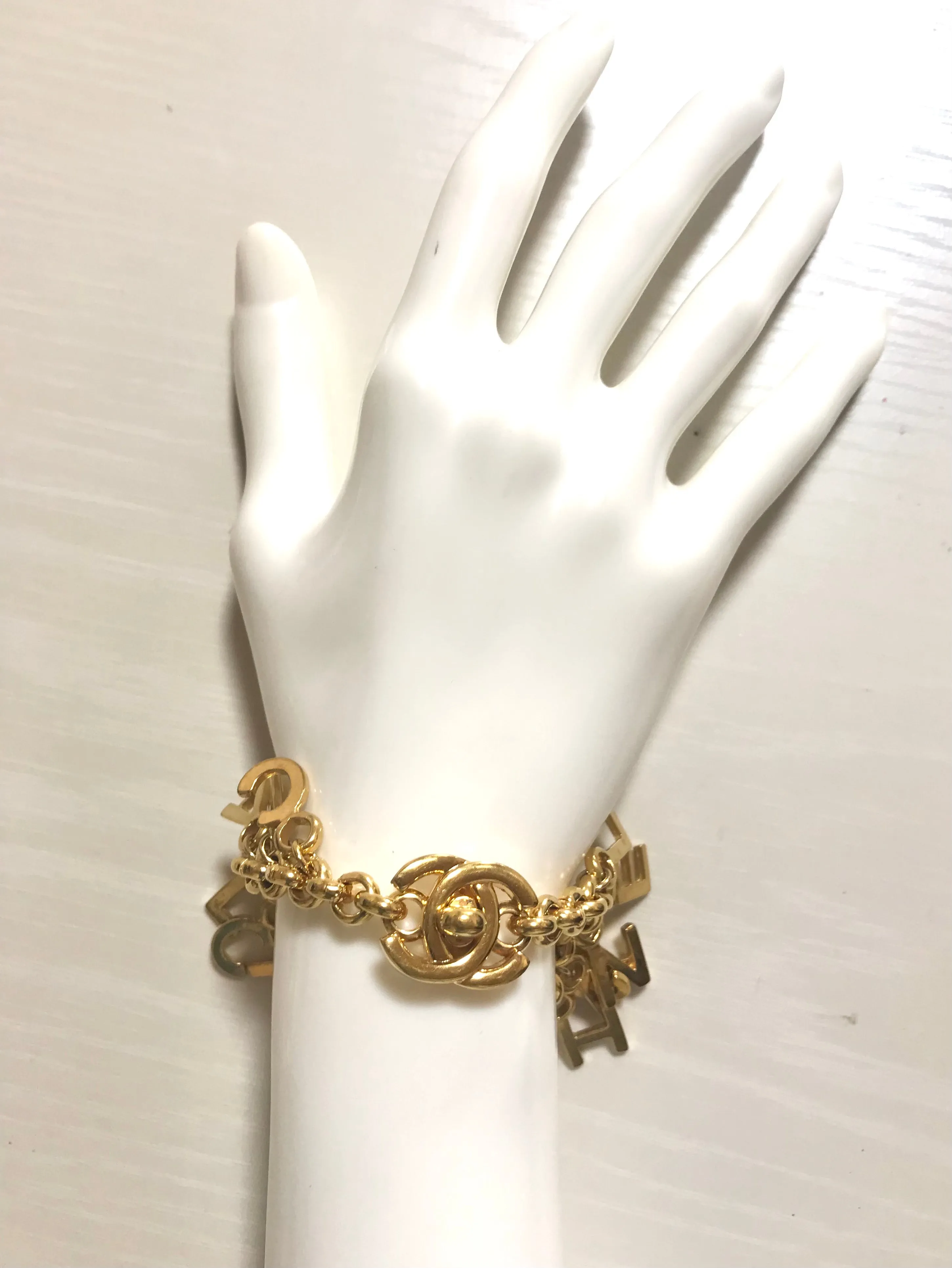 Vintage Chanel Turnlock CC closure and CHANEL letter dangle bracelet. Must have 90s jewelry. CC and logo letter charm bracelet. 060801re