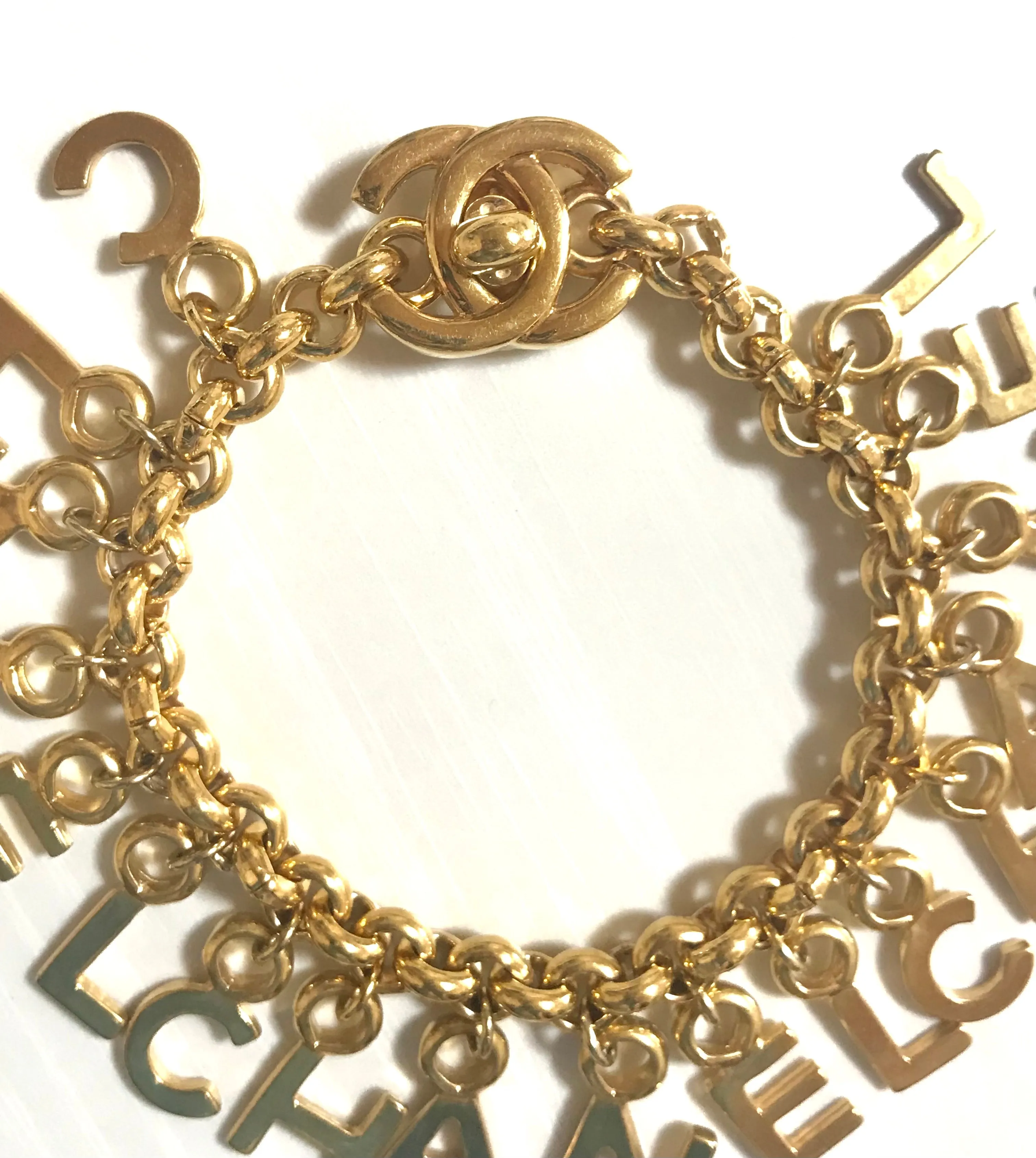 Vintage Chanel Turnlock CC closure and CHANEL letter dangle bracelet. Must have 90s jewelry. CC and logo letter charm bracelet. 060801re