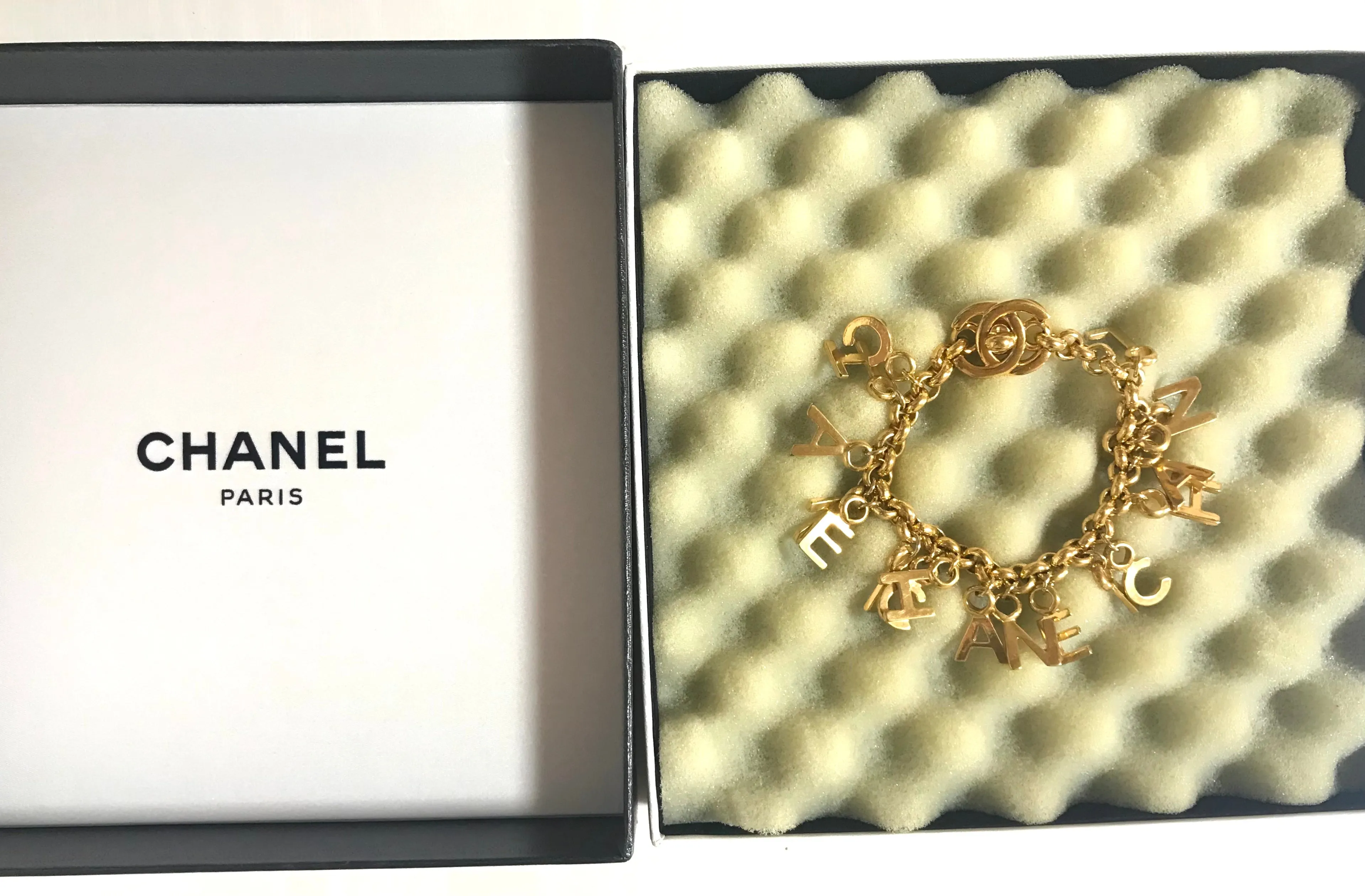 Vintage Chanel Turnlock CC closure and CHANEL letter dangle bracelet. Must have 90s jewelry. CC and logo letter charm bracelet. 060801re