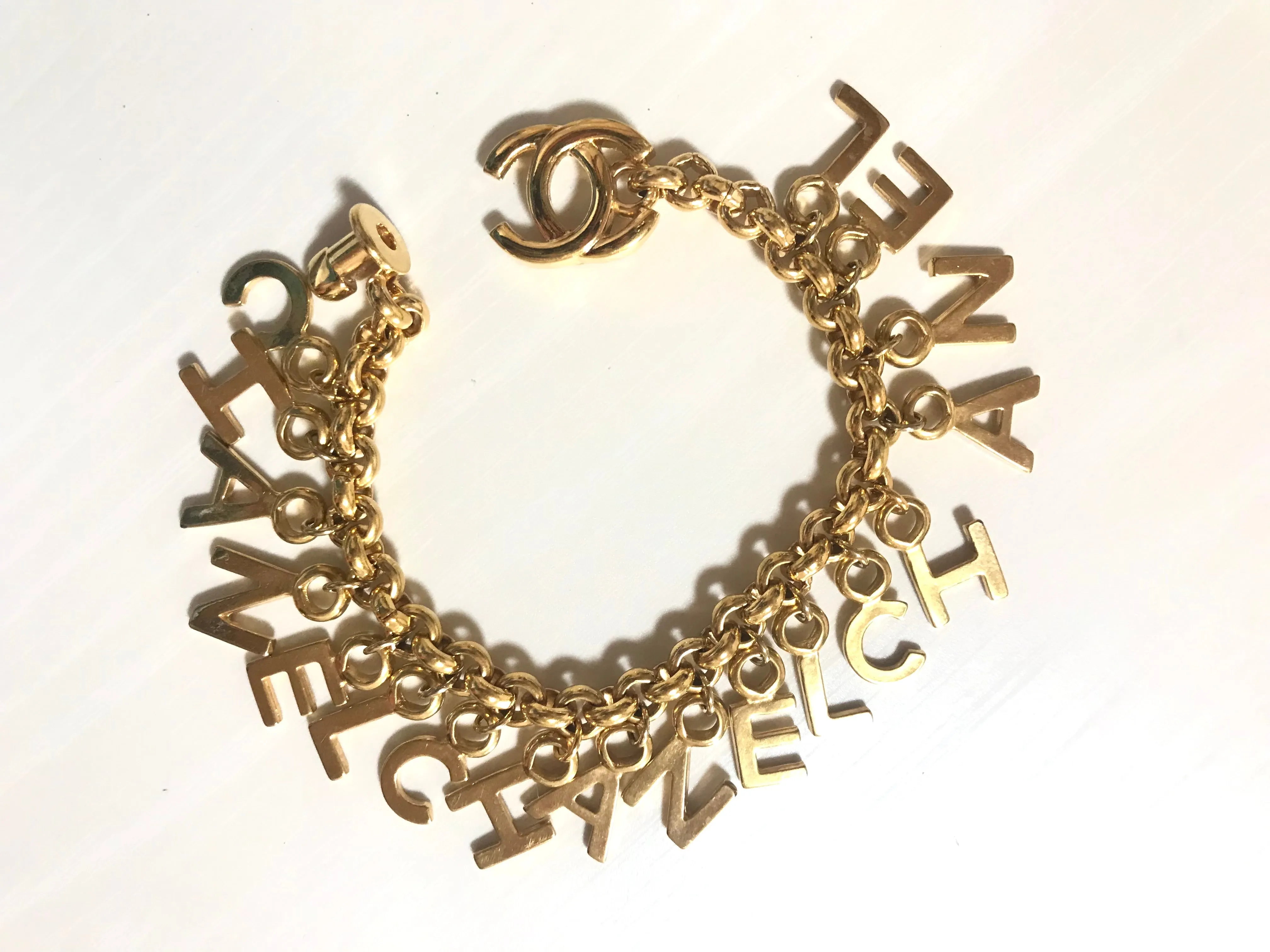 Vintage Chanel Turnlock CC closure and CHANEL letter dangle bracelet. Must have 90s jewelry. CC and logo letter charm bracelet. 060801re