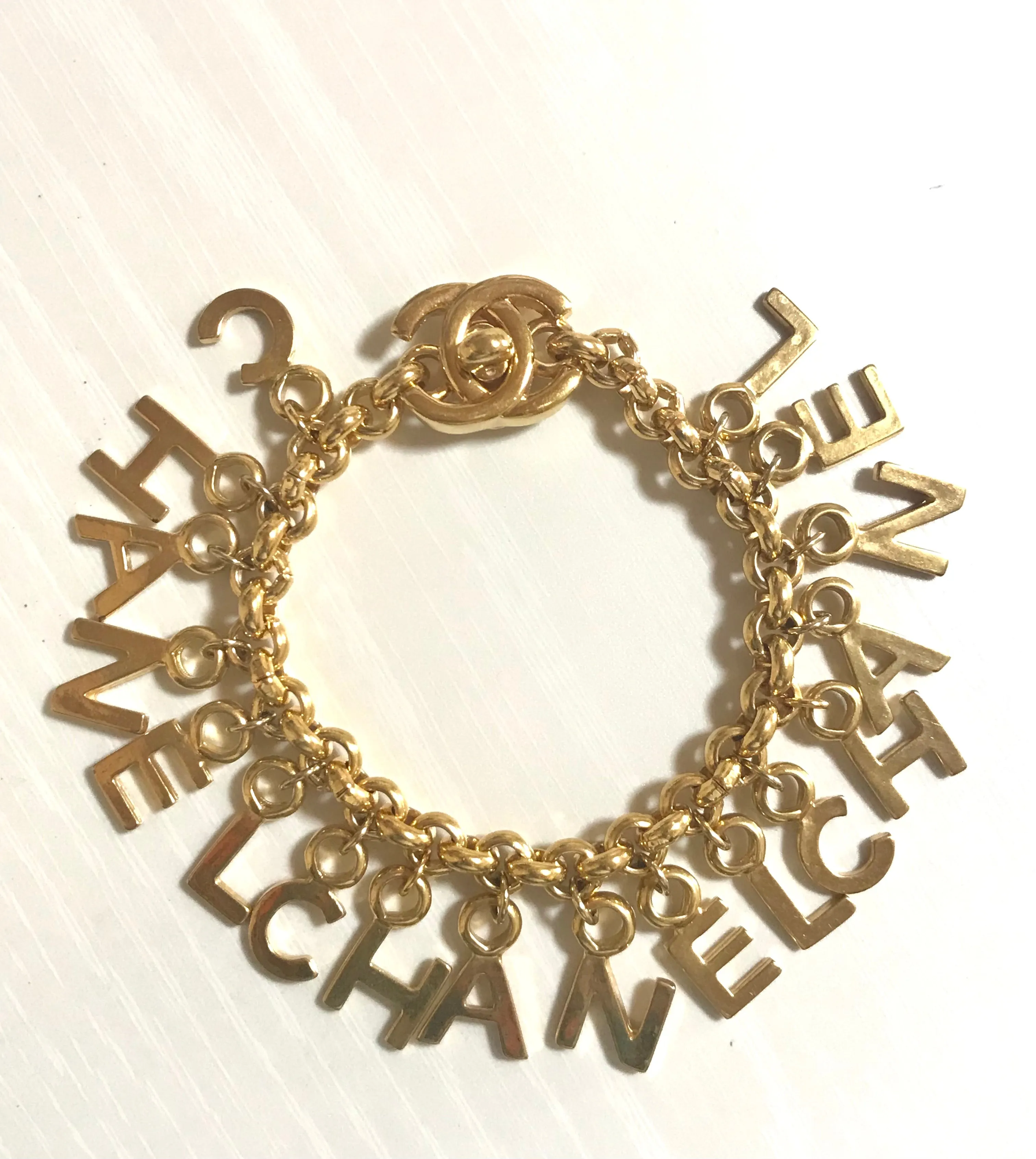 Vintage Chanel Turnlock CC closure and CHANEL letter dangle bracelet. Must have 90s jewelry. CC and logo letter charm bracelet. 060801re