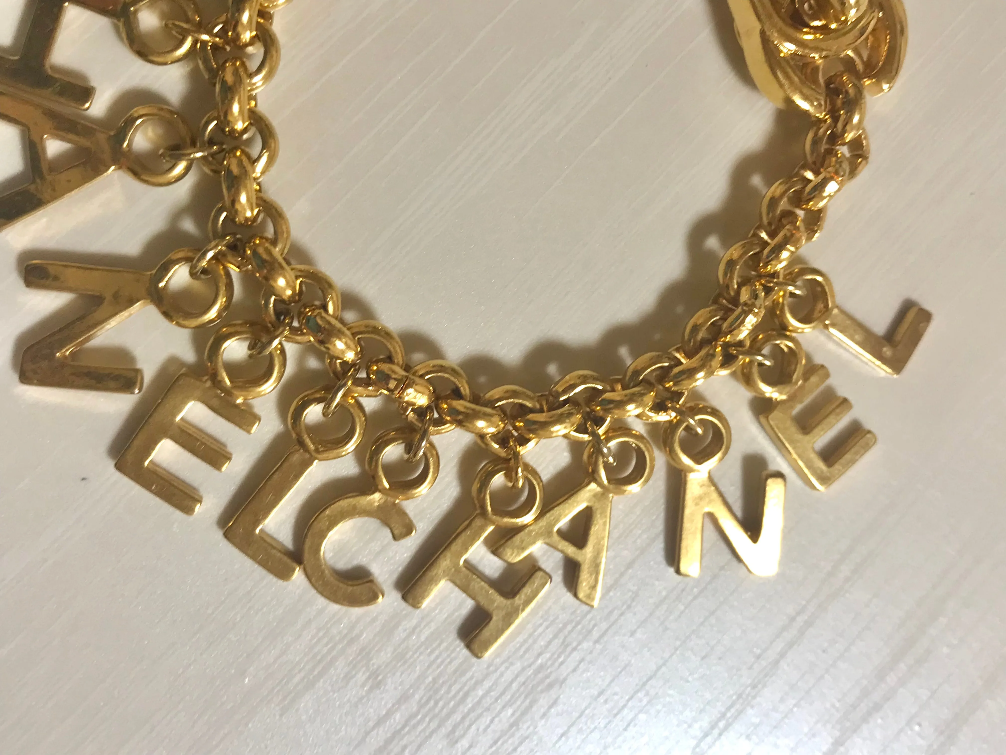 Vintage Chanel Turnlock CC closure and CHANEL letter dangle bracelet. Must have 90s jewelry. CC and logo letter charm bracelet. 060801re
