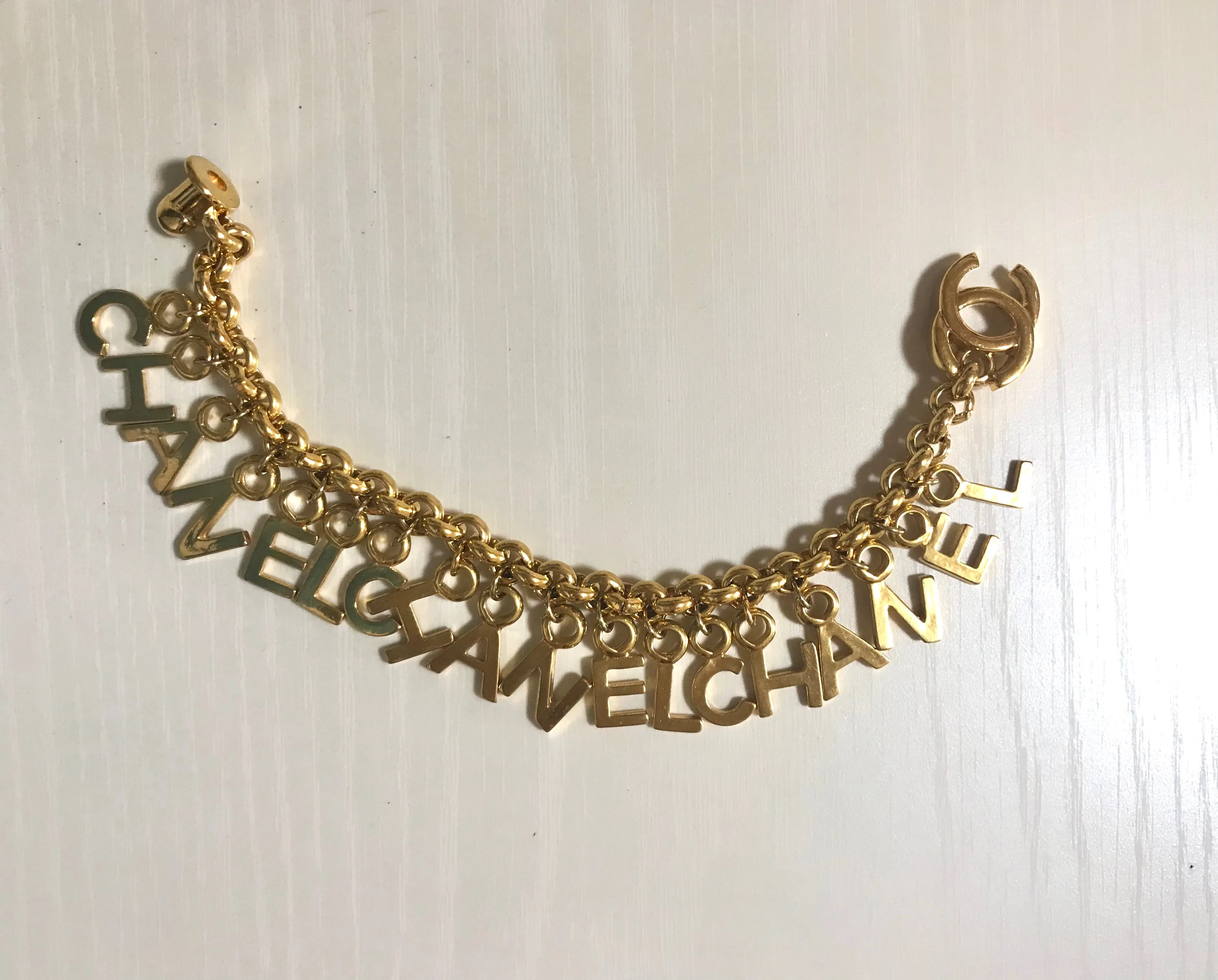 Vintage Chanel Turnlock CC closure and CHANEL letter dangle bracelet. Must have 90s jewelry. CC and logo letter charm bracelet. 060801re