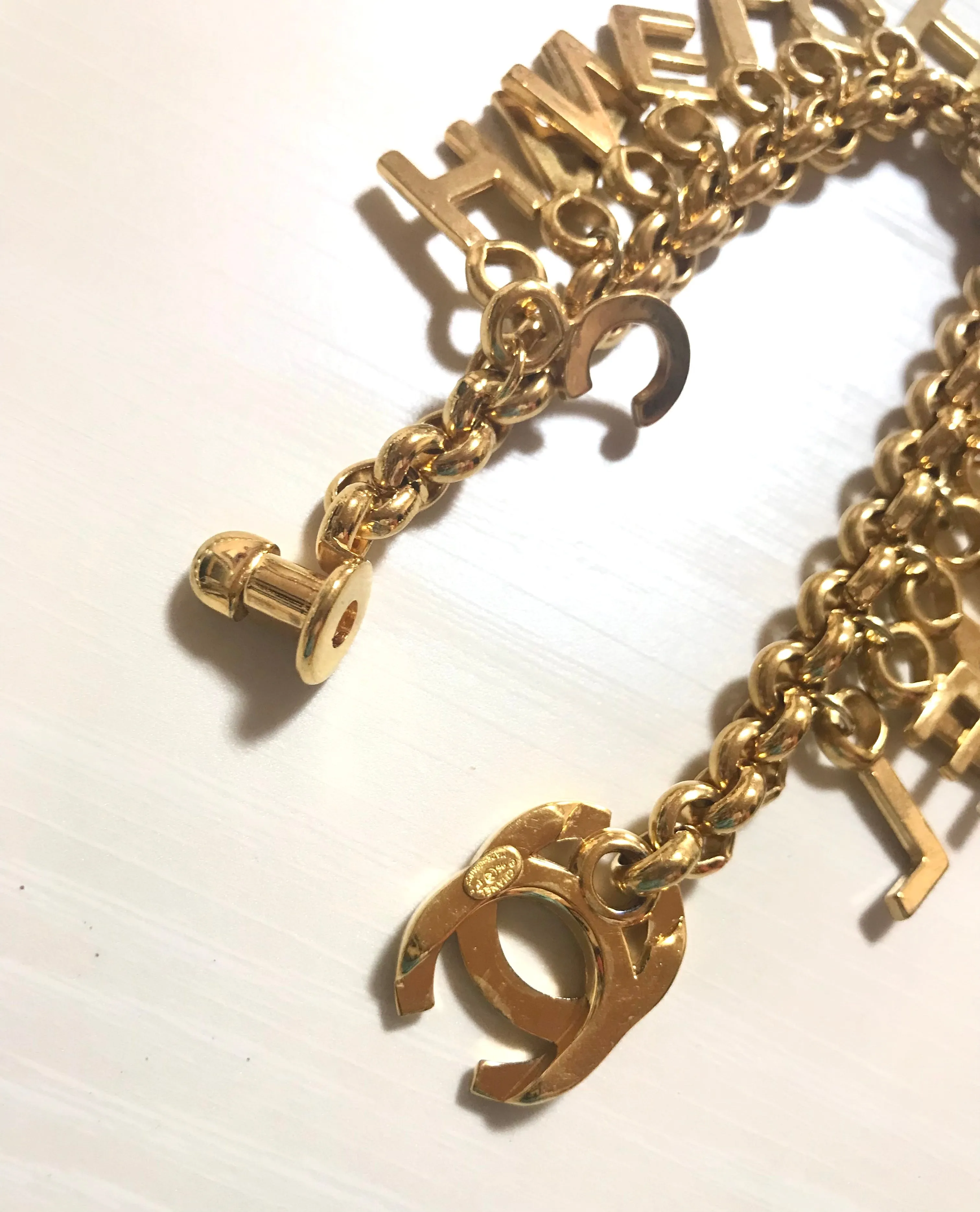 Vintage Chanel Turnlock CC closure and CHANEL letter dangle bracelet. Must have 90s jewelry. CC and logo letter charm bracelet. 060801re