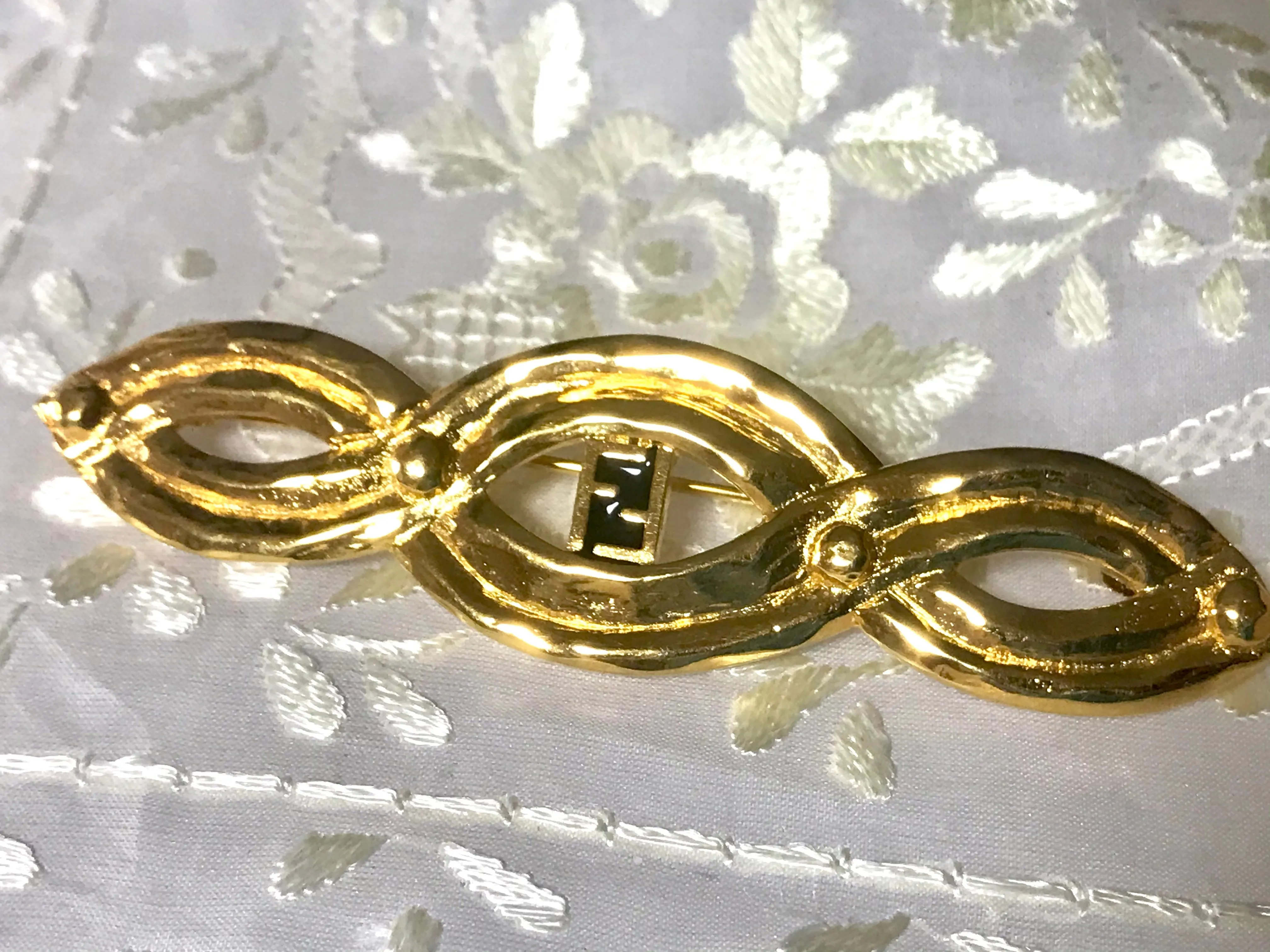 Vintage FENDI gold tone twisted design brooch pin, hat pin with FF mark. Can be used as a brooch pin, jacket brooch pin too