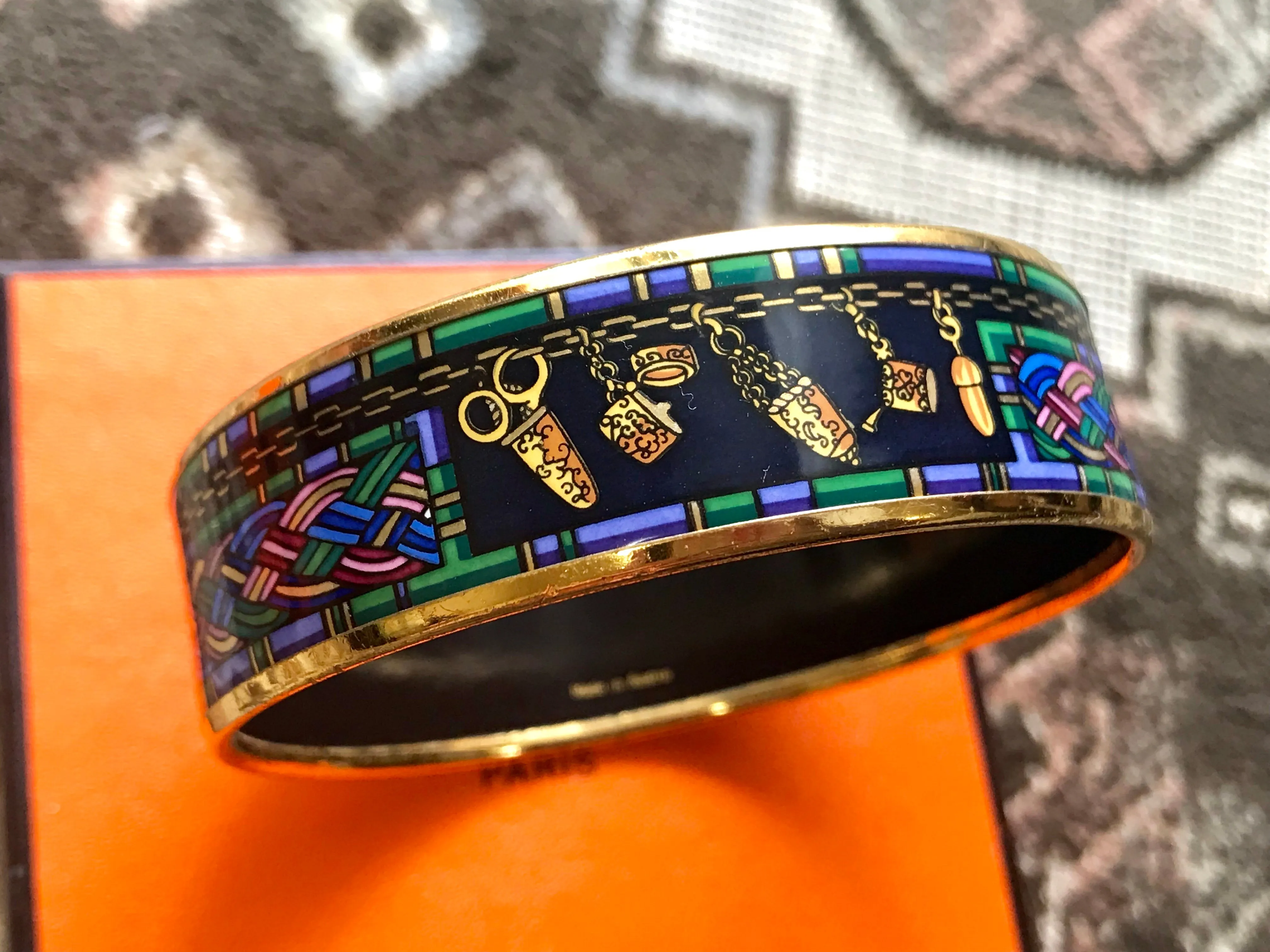 Vintage Hermes golden enamel and cloisonne bangle, bracelet with blue, purple, green etc. Scissors and woven tape motifs. 060426re